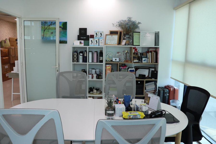Meeting table — awards shelf and storage