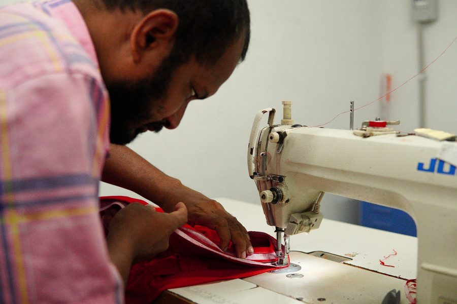 On the line — stitching red tees